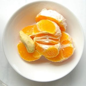 Peeled oranges in a bowl.