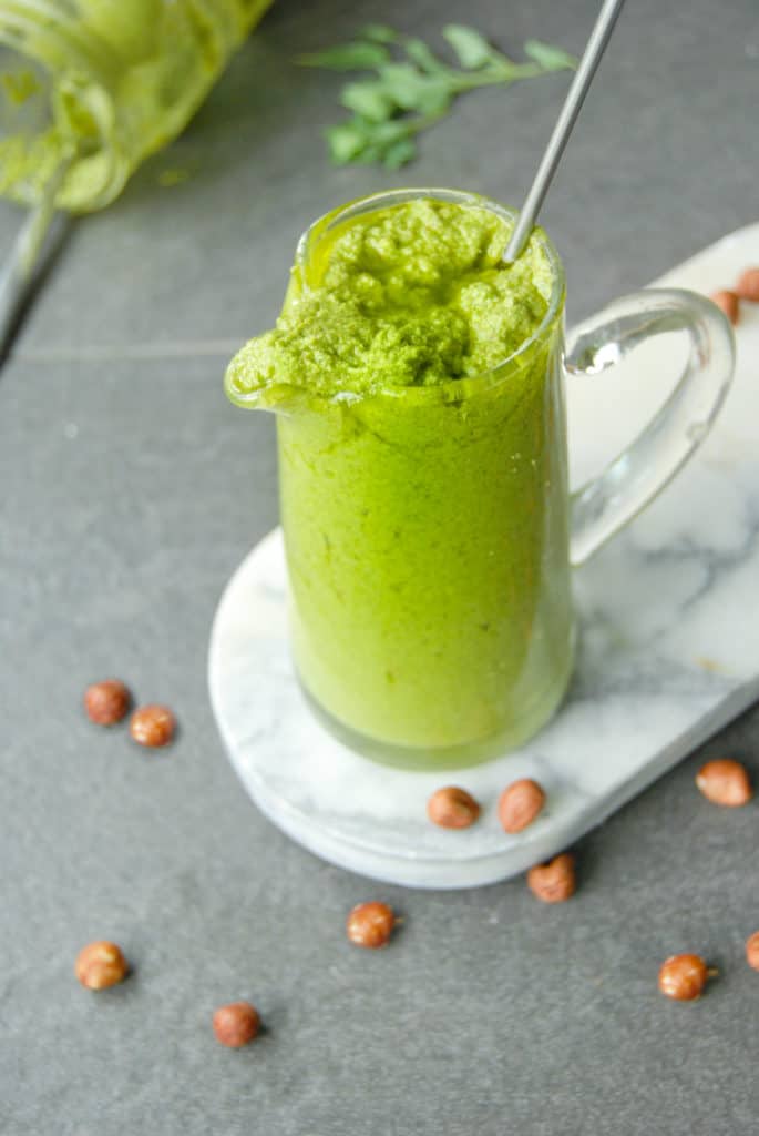 Fresh oregano pesto in a jar ready to use in oregano recipes.