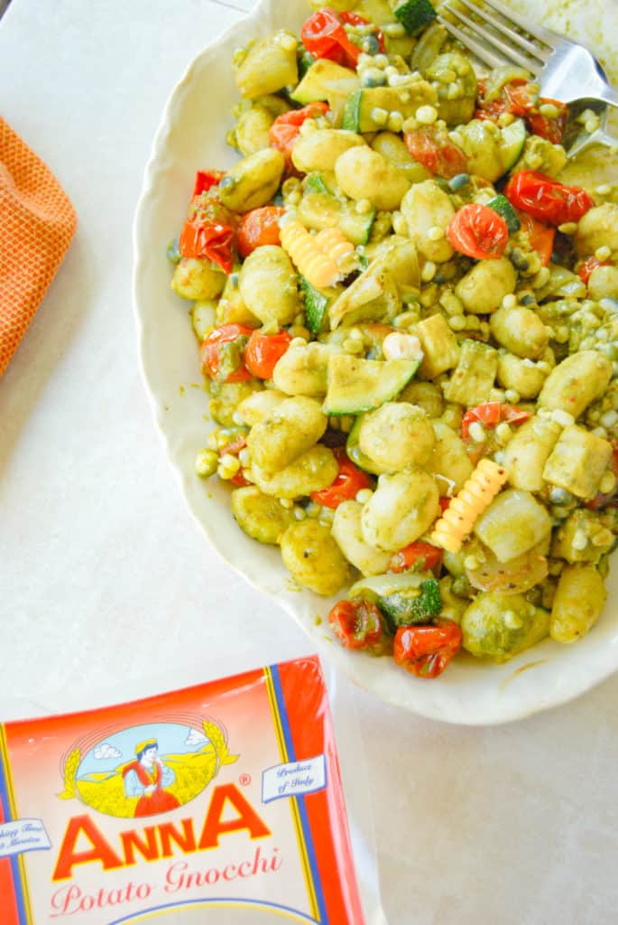 Anna potato gnocchi next to a platter of gnocchi succotash
