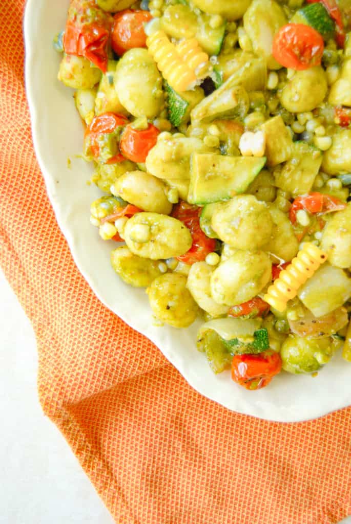 serving platter of gnocchi with vegetables
