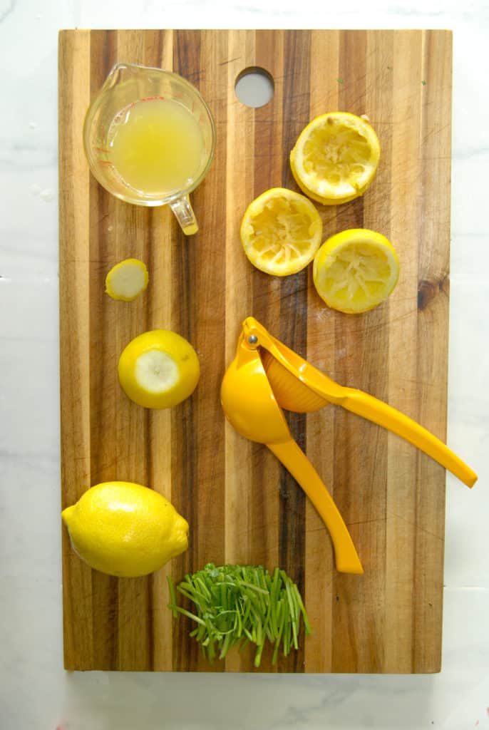 lemons on a cutting board being used for cilantro detox juice