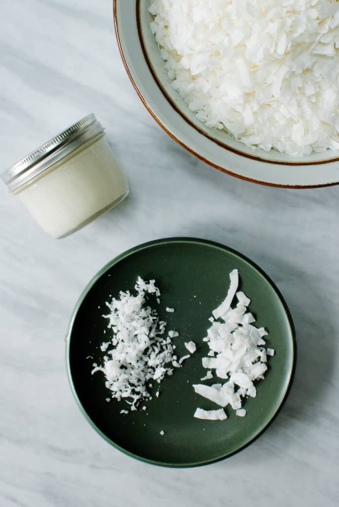 coconut flakes on a plate to make coconut butter
