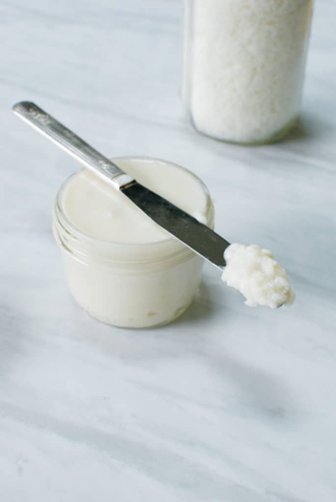A jar of coconut butter on the counter