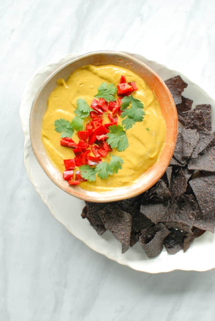 A serving dish full of healthy pumpkin queso.