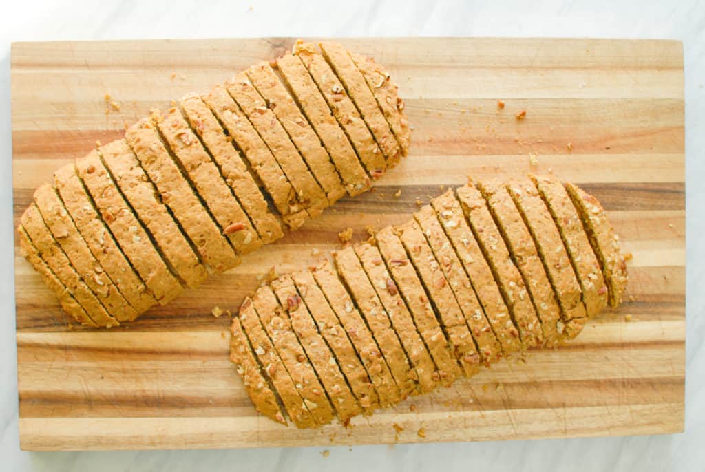 Sliced biscotti on a cutting board.