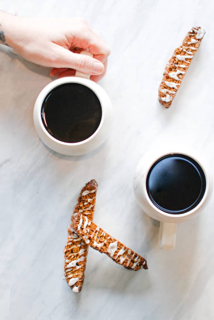 pumpkin biscotti and coffee mugs on the counter