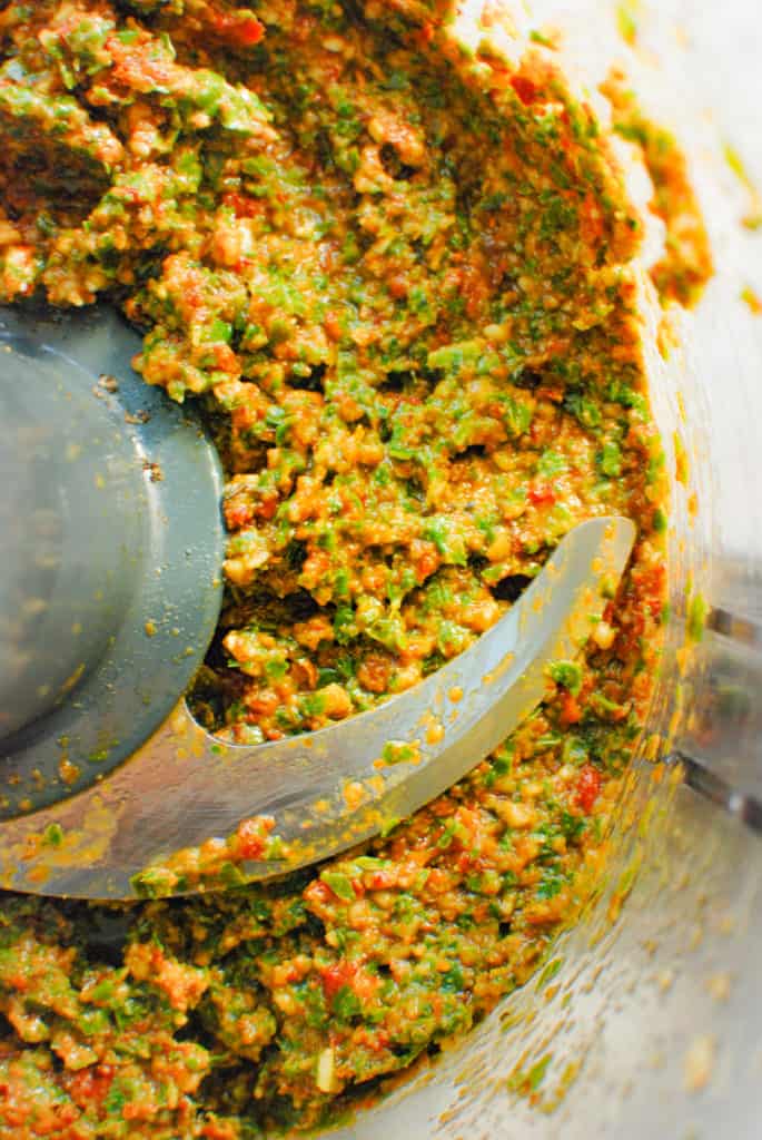 close up of sundried tomato pesto in a food processor