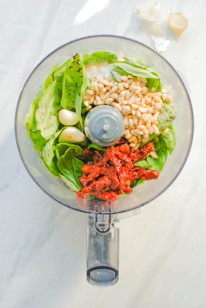 how to make willamette transplant's sundried tomato pesto recipe in a food processor, overhead shot
