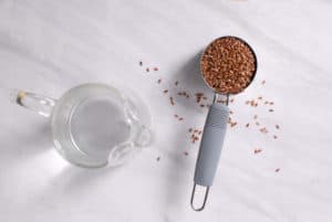 a measuring cup of flaxseeds