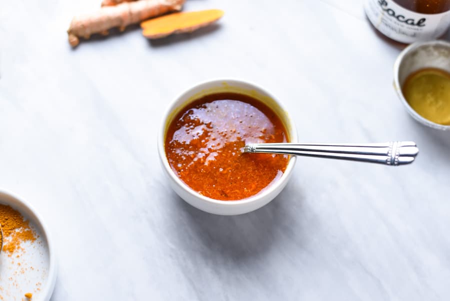 a bowl of homemade turmeric honey