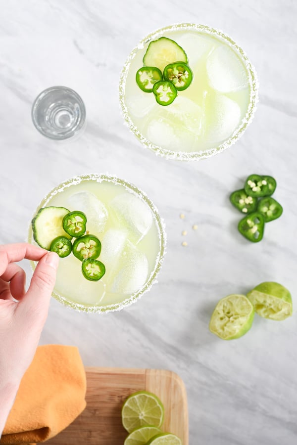 overhead cucumber jalapeno margaritas on a counter