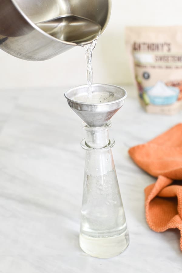 xylitol syrup being poured into a container