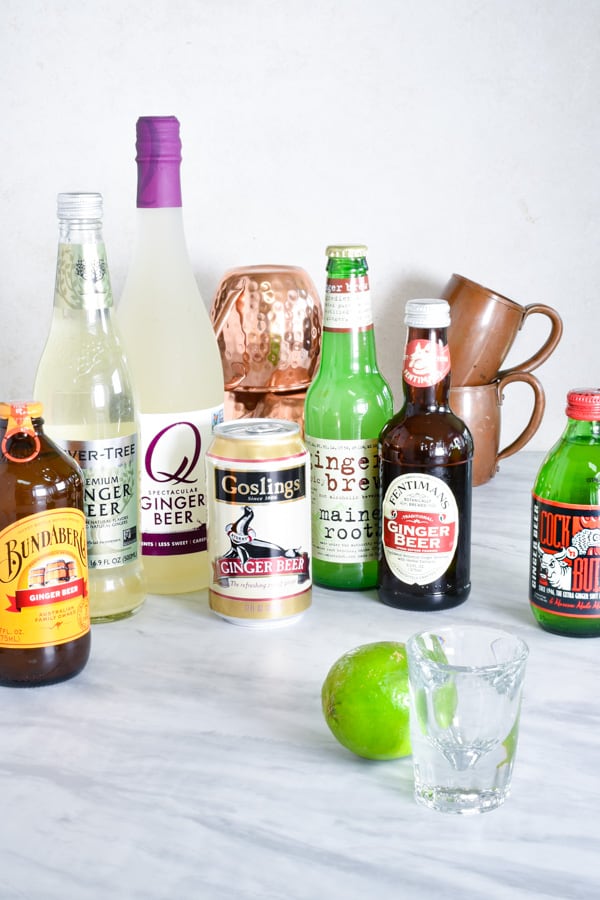 cans and bottles of ginger beer on the counter