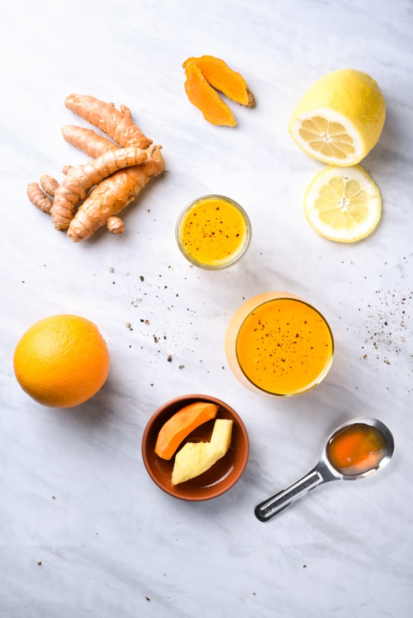 Ingredients to make fresh turmeric juice