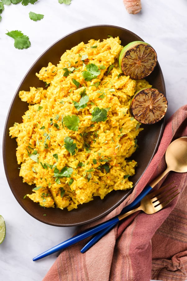 overhead view of yellow turmeric rice on a plate