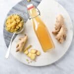 a bottle of homemade ginger simple syrup on the counter