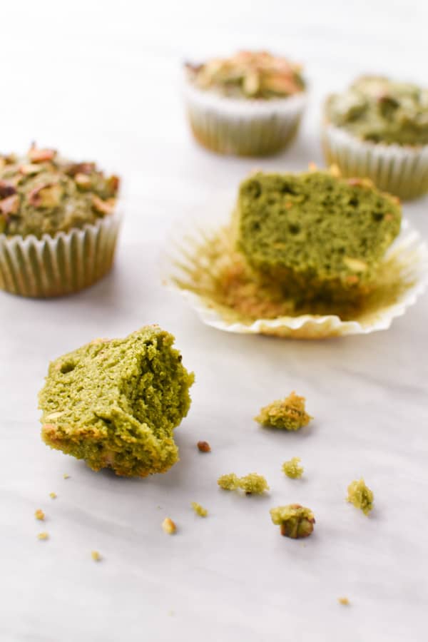 a green pistachio muffin cut in half