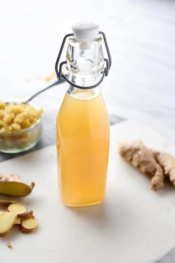 a clear bottle showing ginger syrup