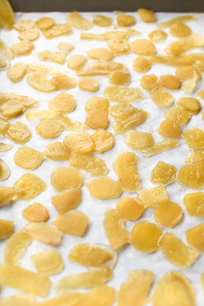 Crystallized ginger drying on parchment paper