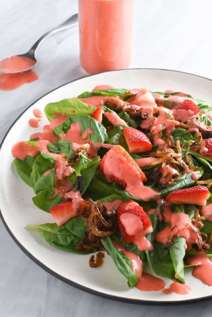 Strawberry vinaigrette on a spinach salad.