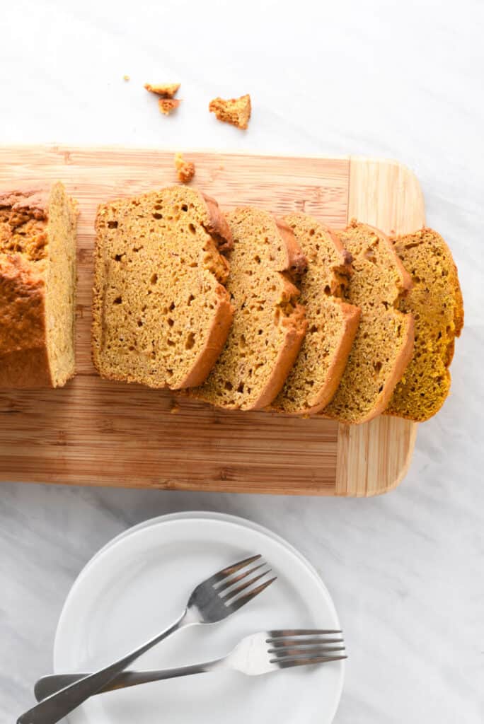 a loaf of vegan pumpkin bread cut into slices