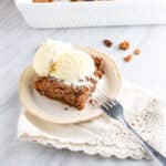 a slice of pumpkin cobbler with vanilla ice cream