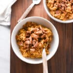 two bowls of pumpkin oatmeal on the table.