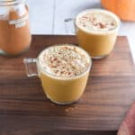 Vegan pumpkin spice latte on a cutting board