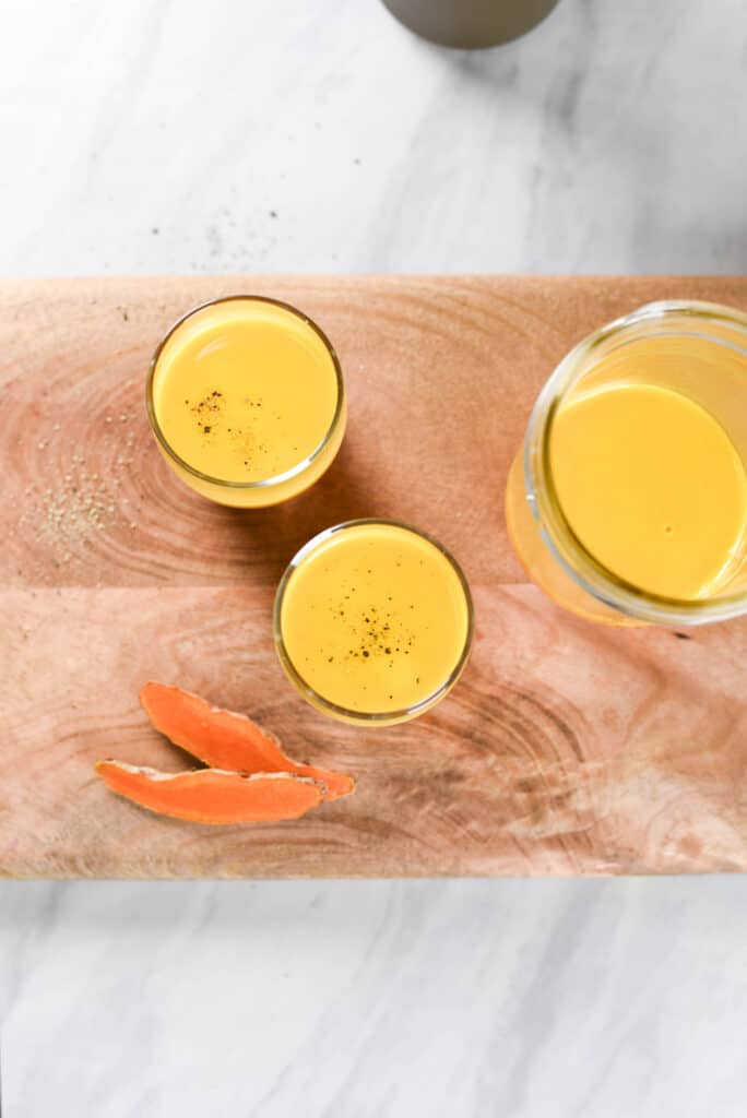 overhead image of 3 turmeric shots